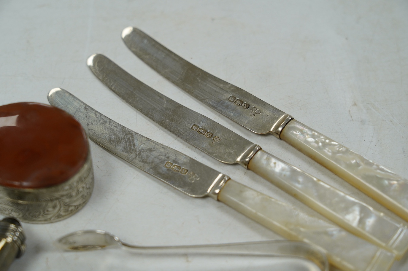 A 19th century white metal mounted tusk vinaigrette? (lacking grille), 11cm and a small quantity of 19th century and later silver cutlery, 10.4oz, including a cased christening trio and a Georg Jensen spoon and a box. Co